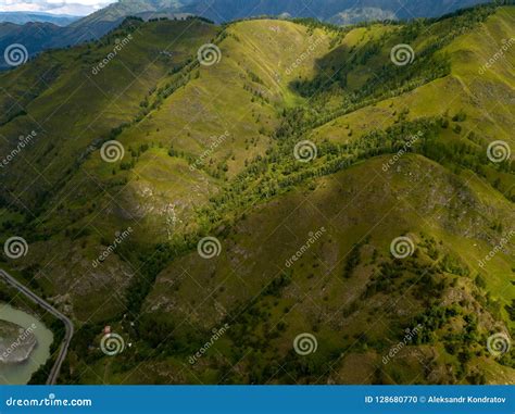Aerial View Of The Mountains With Green Grass And Trees With Lot Stock