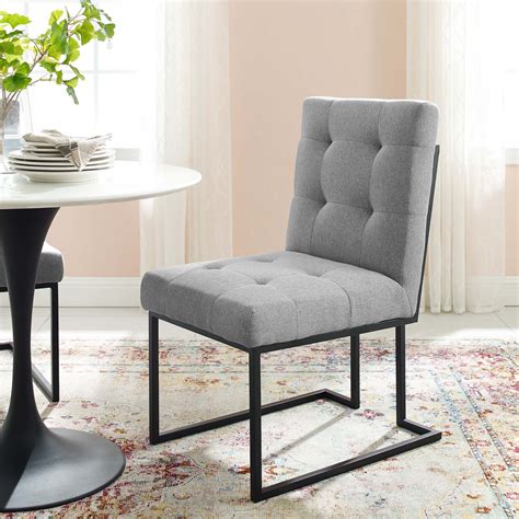 If you prefer the comfort of traditional upholstered chairs but are also looking for the contemporary look of designer metal, plastic or wooden chairs, then cult furniture's. Privy Black Stainless Steel Upholstered Fabric Dining Chair