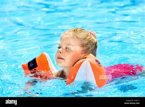 Child With Armbands In Swimming Pool Stock Photo Alamy