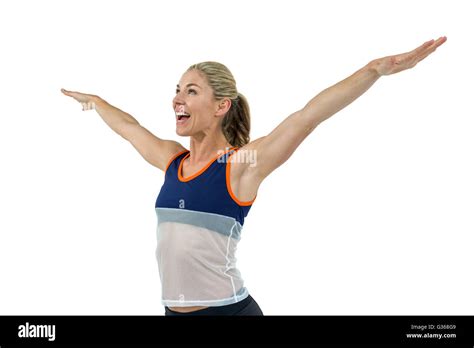 Excited Female Athlete With Arms Outstretched Stock Photo Alamy