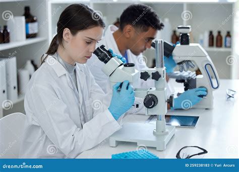 Its A Day Of Research Two Scientists Using Microscopes In A Lab Stock