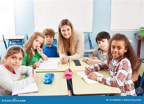 Group Of Primary School Students In Tutoring Lessons Stock Image