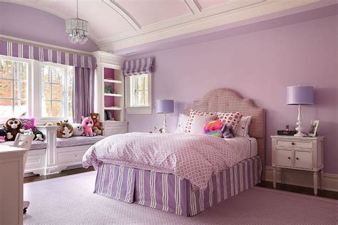 A Bedroom Decorated In Purple And White With Teddy Bears On The Bed