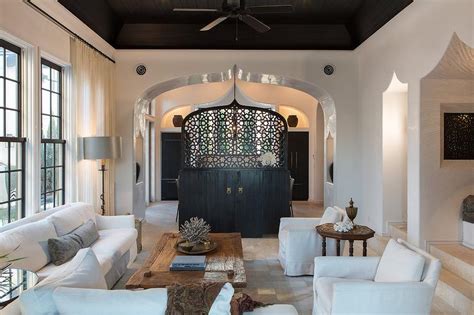 Tray ceilings are certainly not outdated in this day and age. Black Tray Ceiling - Mediterranean - living room - Alys Beach