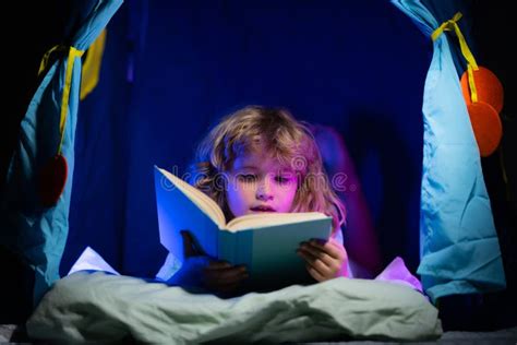 Child Reading Book Kids Bedtime Boy Read Book In Bed Stock Photo