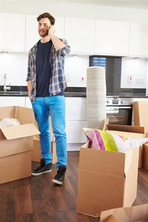 Man Moving Into New Home Talking On Mobile Phone Stock Image Image Of
