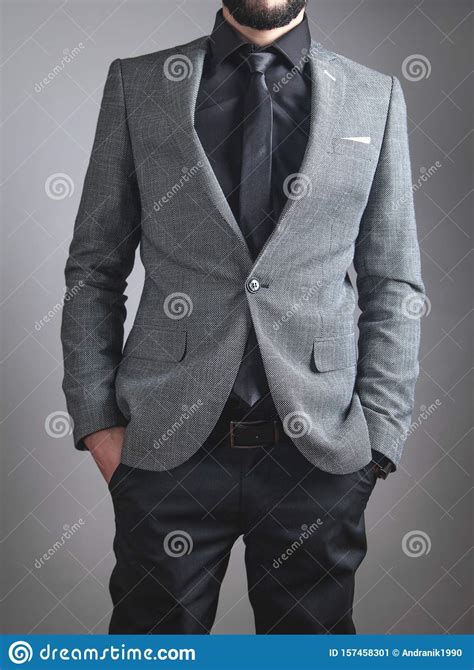 Businessman Wearing Black Tie And Jacket Standing In Office Stock Image