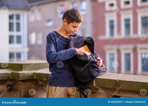 Concentrated Boy Packing His Schoolbag After School Stock Image Image