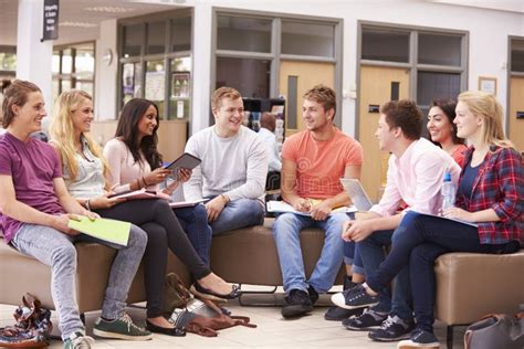 Group Of College Students Sitting And Talking Together Stock Image