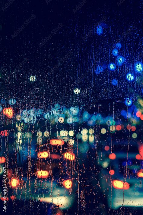 City View Through A Window On A Rainy Nightrain Drops On Window With