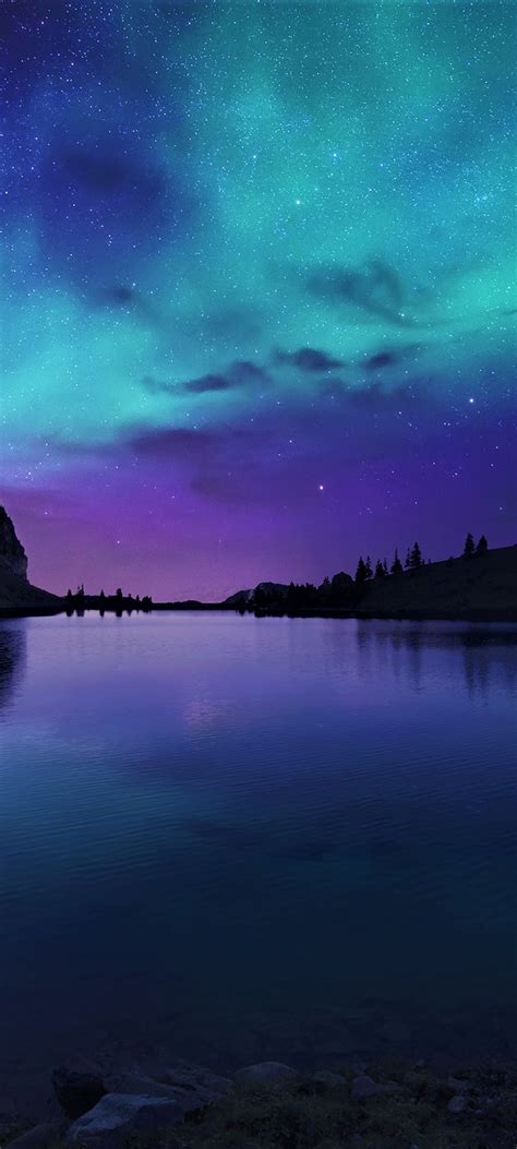 Hd wallpapers and background images 1080x2400 Aurora Borealis Northern Lights Over Mountain ...
