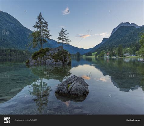 Lake Hintersee With Mountains And Trees Growing On Small Rock Island