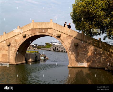 Ancient Chinese Bridge In Zhouzhuang Water Town China Stock Photo Alamy