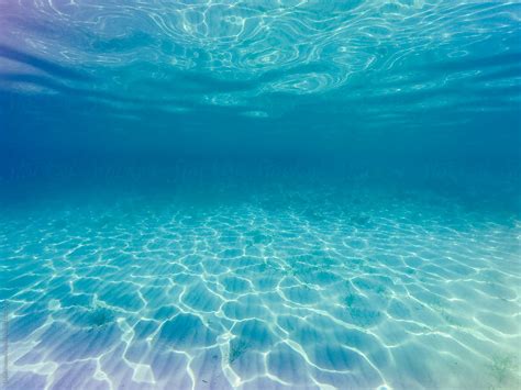 Sunray Ripples Underwater In Clear Blue Sea Water By Dejan Ristovski
