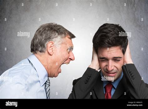 Angry Businessman Shouting To An Employee Stock Photo Alamy