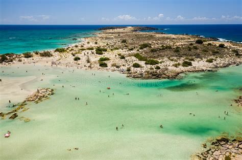 Aerial View Of Shallow Sandy Lagoons And A Beach Surrounded By Deeper