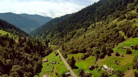 Scenic Countryside Landscape In Carpathian Mountains Valley In
