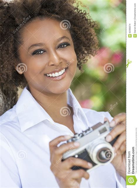 Mixed Race African American Woman With Camera Stock Photo