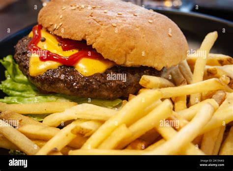 Burger Hamburger With Beef French Fries Ketchup Cheese And Lettuce