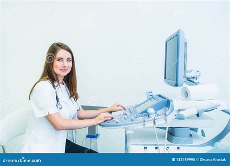 Portrait Of Young Smiling Doctor Ultrasound Specialist Looking At