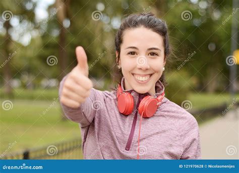 Smiling Female Athlete Showing Her Thumbs Up Stock Photo Image Of Cheerful Hispanic