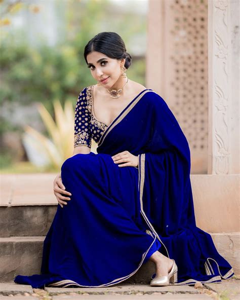 parvati nair in monotone blue saree with hints of gold
