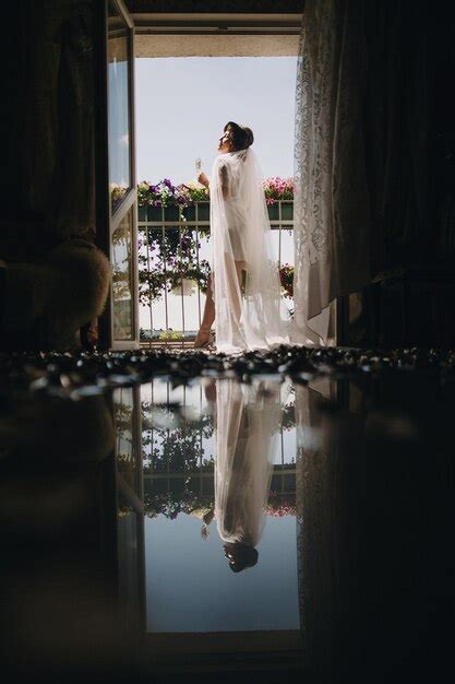 Premium Photo Beautiful Stylish Brunette Bride In Silk Robe And Veil
