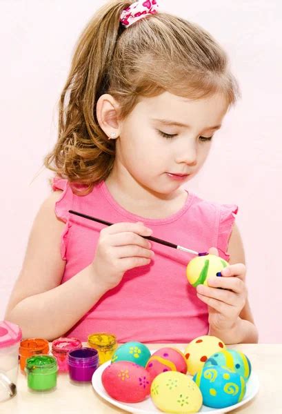 Cute Little Girl Painting Easter Eggs Stock Photo By ©svetamart 41605027