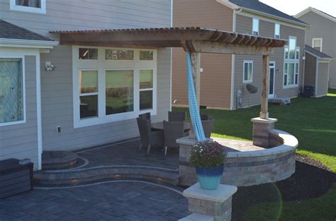 Light colored pavers offer a cooler surface around patios and pool decks. Beautiful Outdoor Paver Patio with Cedar Pergola. Sand ...