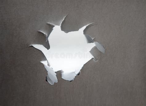Hole Punched In A Paper Sheet Stock Image Image Of Crack Empty
