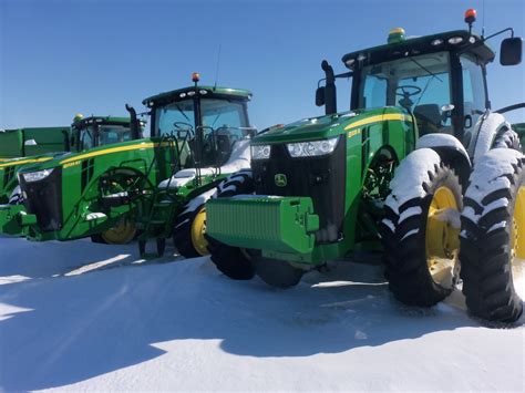 John Deere 8335R on right & track version 8335RT on left John Deere