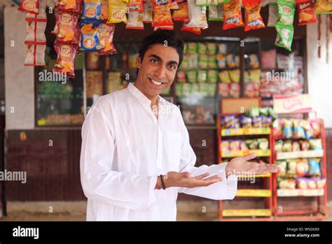 Portrait Of A Shopkeeper Smiling Stock Photo Alamy