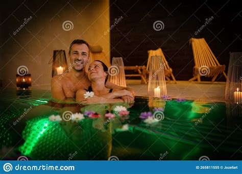 Beautiful Woman And Man Relaxes In The Pool Relax In Spa Stock Image