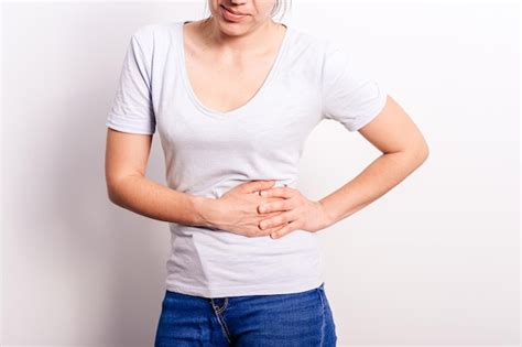 Premium Photo Young Brunette Woman Suffering From Stomach Ache Left Side