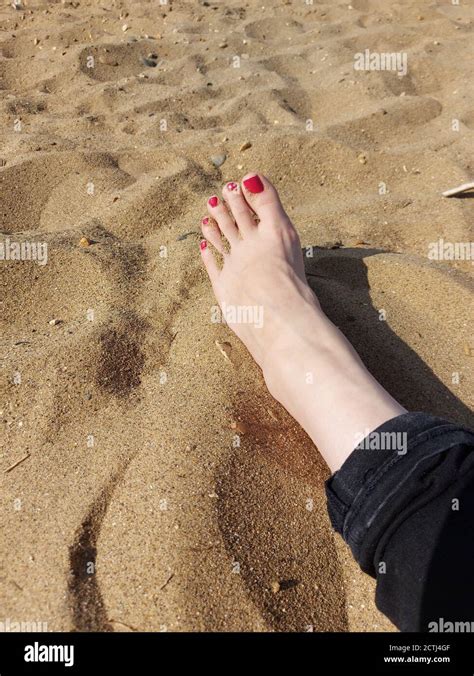 Sand Between Her Toes Womans Foot On A Beach Stock Photo Alamy
