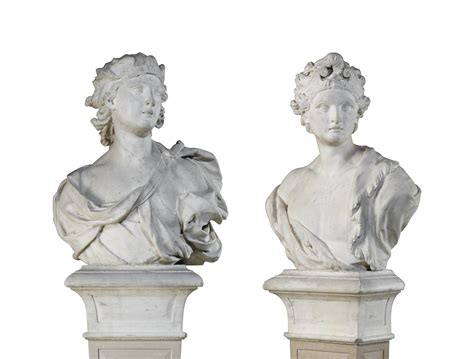 A Pair Of Carved Marble Busts Probably Representing The Elements Fire