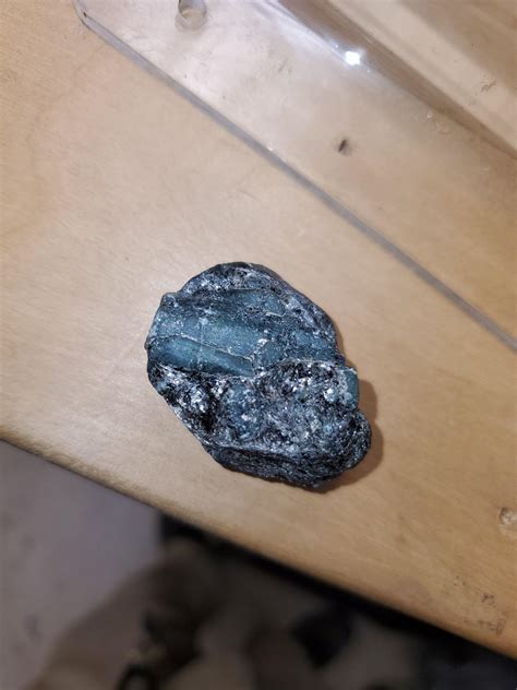 Shiny Black Rock With Separate Green Crystal Embedded Inside Found