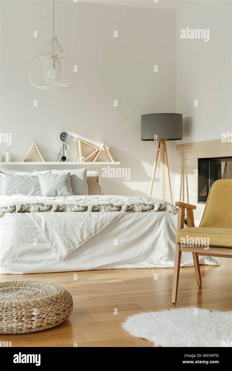 King Size Bed In Bedroom Interior With Gray Lamp Yellow Chair And