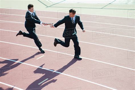 Businessmen Running Relay Race Stock Photo Dissolve