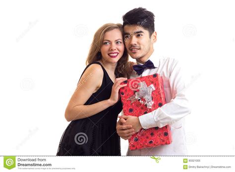 Created by young couple 7 years ago. Young Couple Holding A Present Stock Image - Image of ...