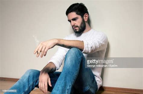 Sad Man Sitting On Floor Photos And Premium High Res Pictures Getty