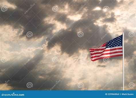 Waving Flag Of United States Of America Against Dramatic Sky Copy