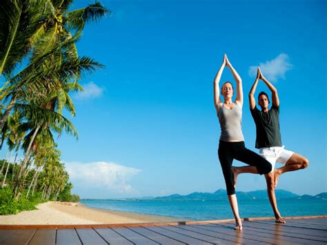 First, take a long deep breath in and while exhaling, brings your hands down. Top 5 Couple Yoga Poses For Beginners - Boldsky.com