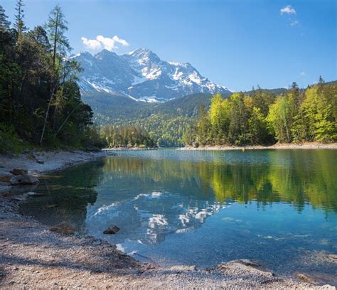 Lake Eibsee And Zugspitze Mountain Reflecting In The Water Spring