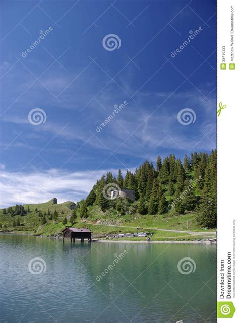 Old Boathouse At Quiet Mountain Lake Stock Image