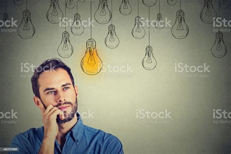 Man Looking Up With Idea Light Bulb Above Head Stock Photo Download