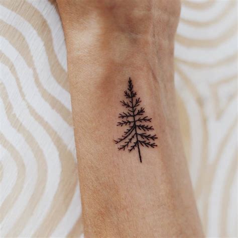 Hand Poked Pine Tree Tattoo On The Wrist