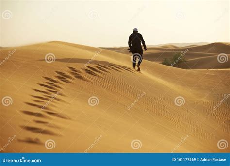 Man Walking In The Desert Stock Image Image Of Background 161177569