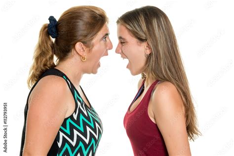 Angry Mother And Her Teenage Daughter Yelling At Each Other Stock Photo