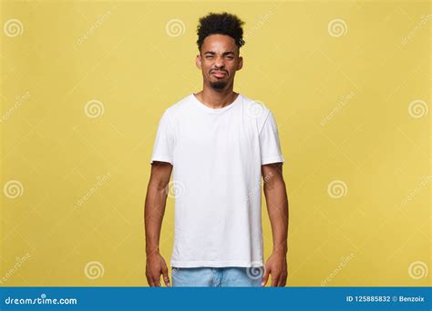 Portrait Of Furious Young Man Long Curly Hair Style Keeps Fists